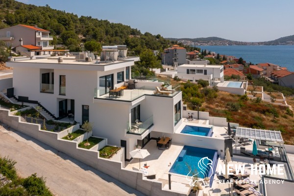 Double villas on a hillside with sea views