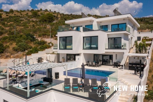 Double villas on a hillside with sea views