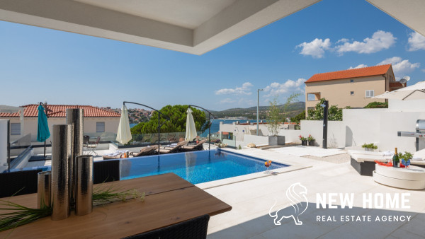 Double villa on a hillside with sea views