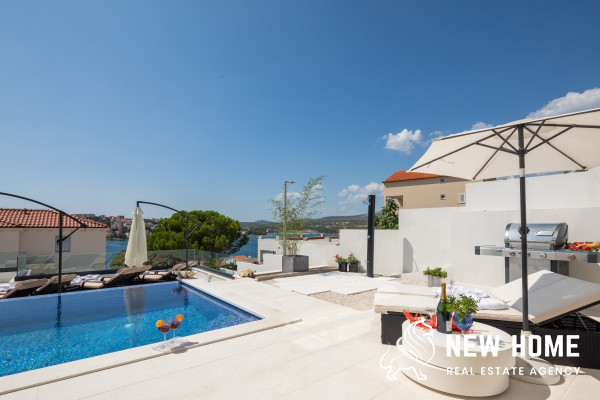 Double villa on a hillside with sea views