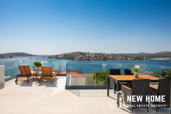 Double villa on a hillside with sea views