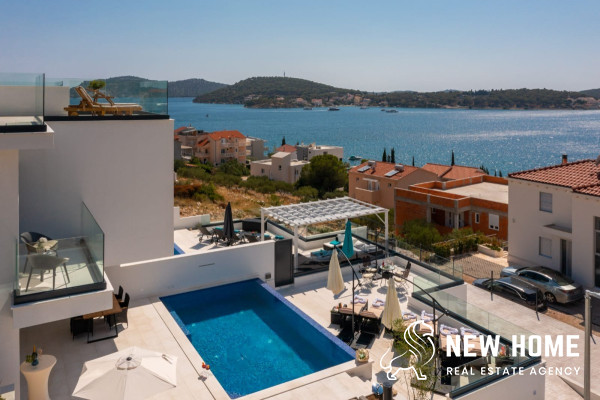 Double villa on a hillside with sea views