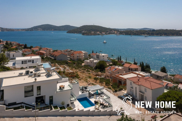 Double villa on a hillside with sea views