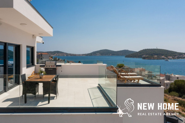 Double villa on a hillside with sea views