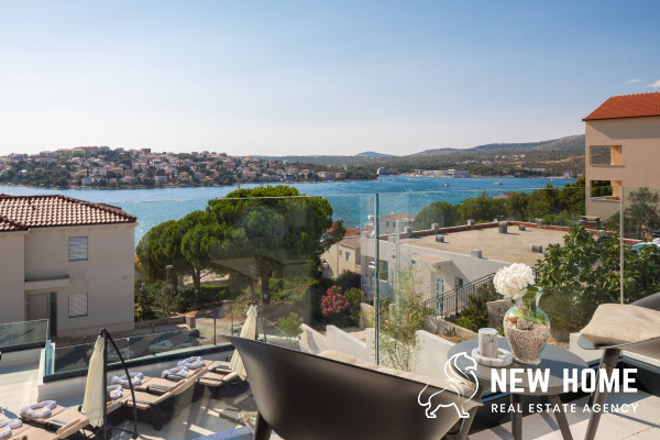 Double villa on a hillside with sea views